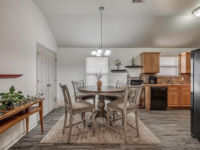 623 SW 37th St, Moore, OK 73160 - dining space with lofted ceiling, dark wood-style floors, and a chandelier