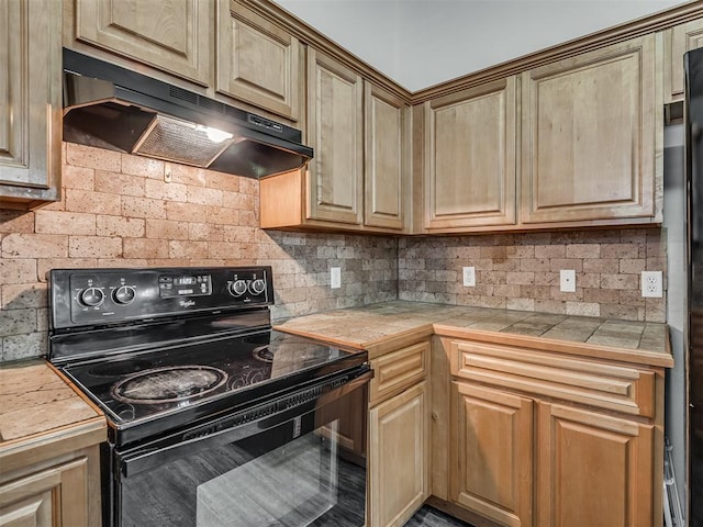623 SW 37th St, Moore, OK 73160 - kitchen with black electric range oven, under cabinet range hood, tasteful backsplash, and tile countertops