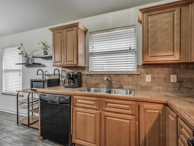 623 SW 37th St, Moore, OK 73160 - kitchen with black appliances, decorative backsplash, wood finished floors, and tile counters