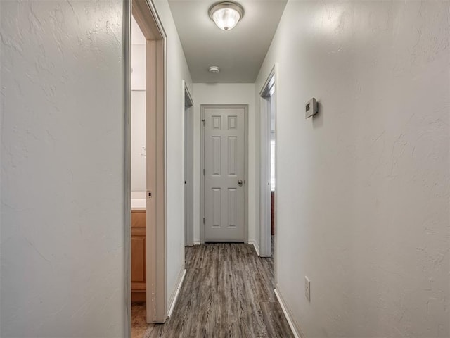 623 SW 37th St, Moore, OK 73160 - hall featuring wood finished floors and baseboards