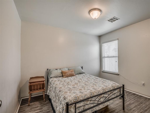 623 SW 37th St, Moore, OK 73160 - bedroom with dark wood-style flooring and baseboards