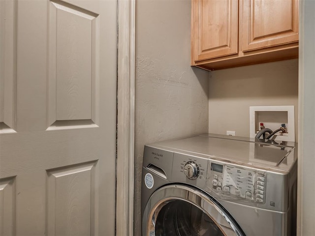 623 SW 37th St, Moore, OK 73160 - laundry room featuring cabinet space, washer / clothes dryer, and a textured wall