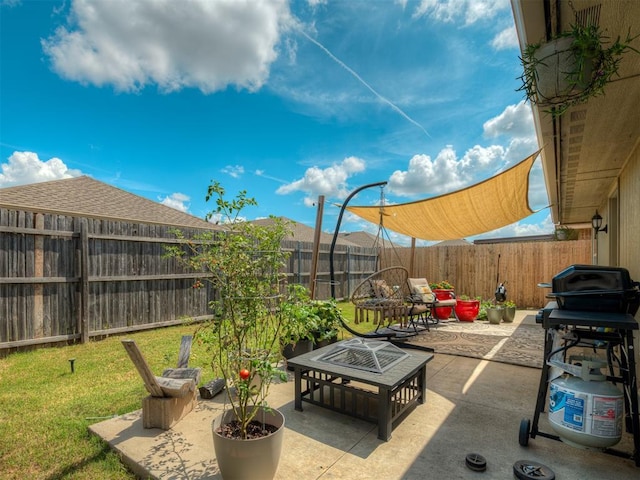 623 SW 37th St, Moore, OK 73160 - fenced backyard featuring grilling area, an outdoor fire pit, and a patio
