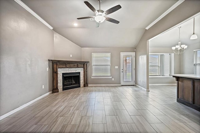 1109 Chestnut Creek Dr, Yukon, OK 73099 - unfurnished living room featuring vaulted ceiling, ceiling fan, a chandelier, a stone fireplace, and light wood finished floors