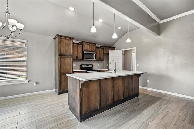 1109 Chestnut Creek Dr, Yukon, OK 73099 - kitchen featuring a chandelier, lofted ceiling, light countertops, stainless steel appliances, and an island with sink