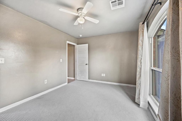 1109 Chestnut Creek Dr, Yukon, OK 73099 - carpeted empty room with baseboards and ceiling fan