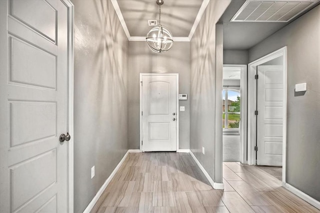 1109 Chestnut Creek Dr, Yukon, OK 73099 - entryway featuring a chandelier and light wood-type flooring