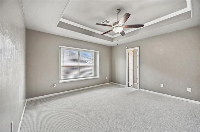 1109 Chestnut Creek Dr, Yukon, OK 73099 - unfurnished room featuring a tray ceiling, a ceiling fan, carpet flooring, and crown molding