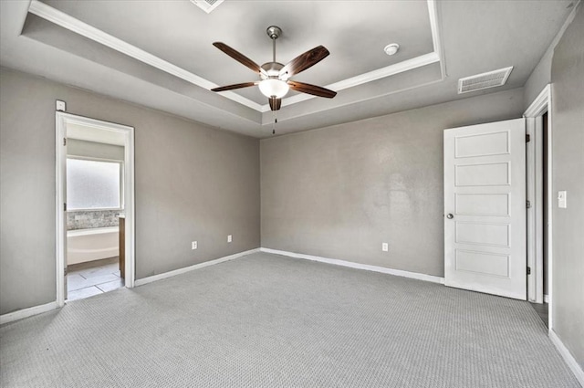 1109 Chestnut Creek Dr, Yukon, OK 73099 - spare room with a tray ceiling, carpet flooring, a ceiling fan, and crown molding