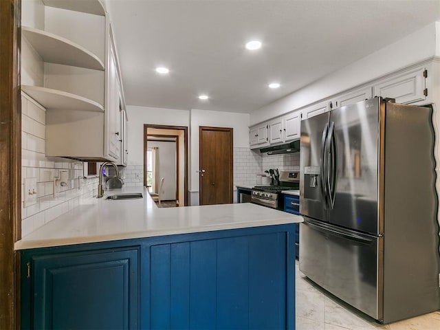 6105 W Gun Hill Way, Warr Acres, OK 73132 - kitchen with open shelves, stainless steel appliances, decorative backsplash, a peninsula, and light countertops