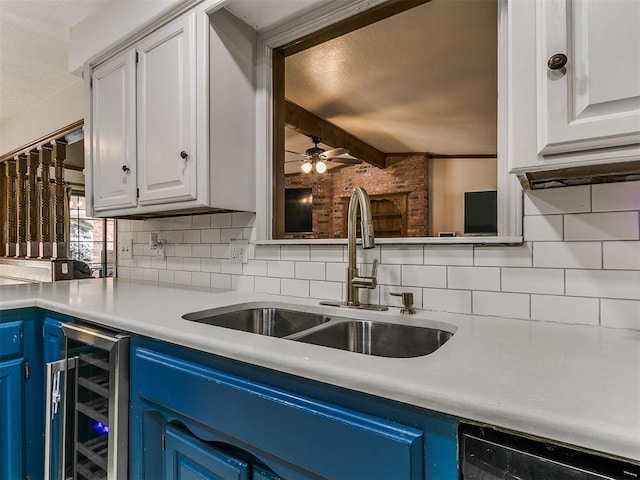 6105 W Gun Hill Way, Warr Acres, OK 73132 - kitchen featuring blue cabinets, backsplash, beverage cooler, and ceiling fan