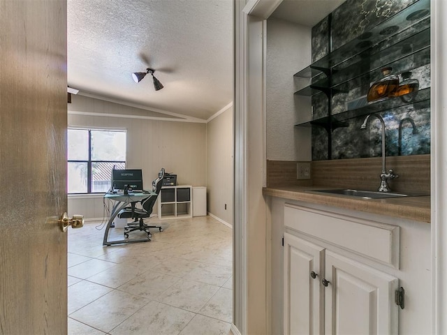6105 W Gun Hill Way, Warr Acres, OK 73132 - office space with vaulted ceiling, ornamental molding, light tile patterned floors, and a textured ceiling