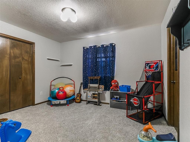 6105 W Gun Hill Way, Warr Acres, OK 73132 - playroom featuring carpet and a textured ceiling