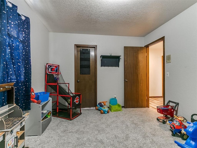 6105 W Gun Hill Way, Warr Acres, OK 73132 - rec room featuring carpet and a textured ceiling