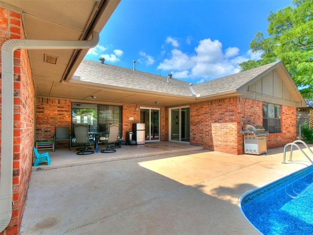 6105 W Gun Hill Way, Warr Acres, OK 73132 - outdoor pool with a patio area, area for grilling, and outdoor dining area
