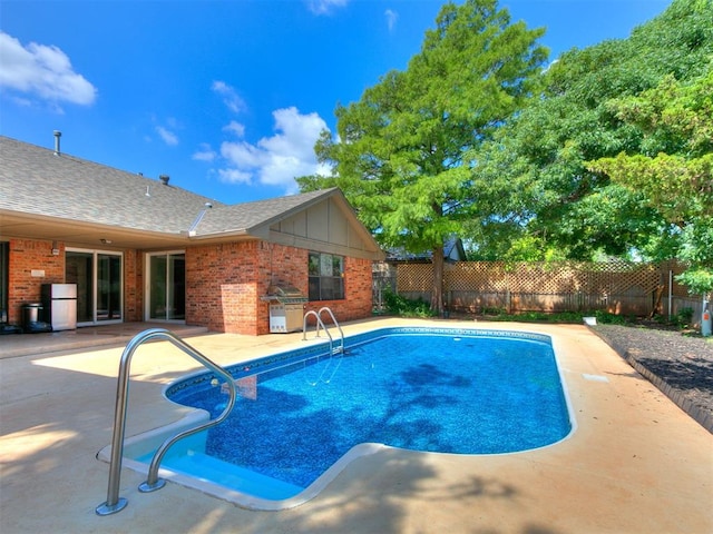 6105 W Gun Hill Way, Warr Acres, OK 73132 - view of swimming pool featuring a fenced backyard, a patio, and grilling area