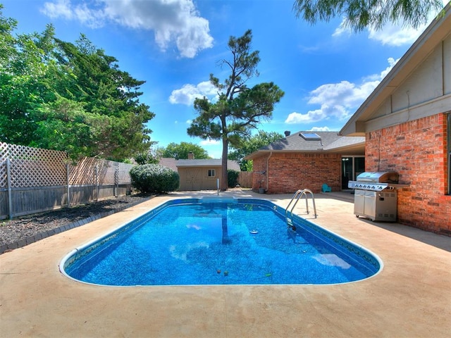 6105 W Gun Hill Way, Warr Acres, OK 73132 - view of pool with a storage shed, a patio area, a fenced backyard, and grilling area