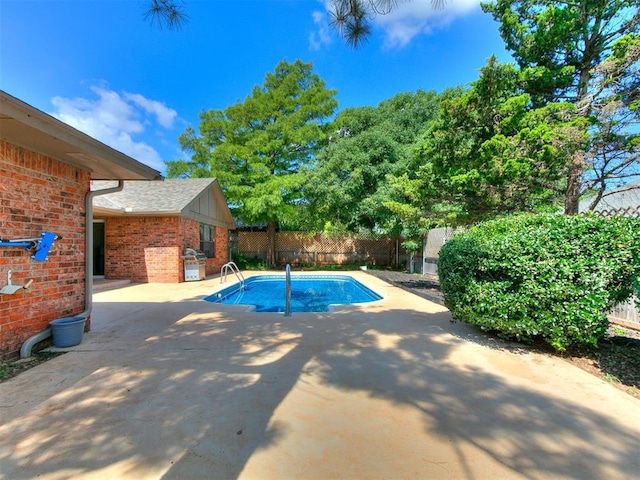 6105 W Gun Hill Way, Warr Acres, OK 73132 - view of swimming pool featuring area for grilling, a fenced backyard, and a patio area
