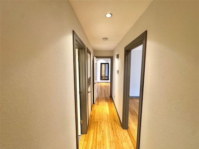 4400 Hemingway Dr Unit 202, Oklahoma City, OK 73118 - corridor with light wood-type flooring, recessed lighting, and a textured wall