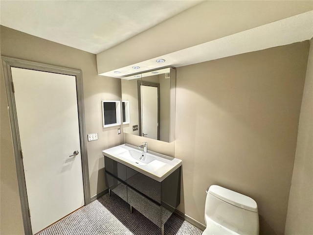 4400 Hemingway Dr Unit 202, Oklahoma City, OK 73118 - half bathroom featuring toilet and vanity