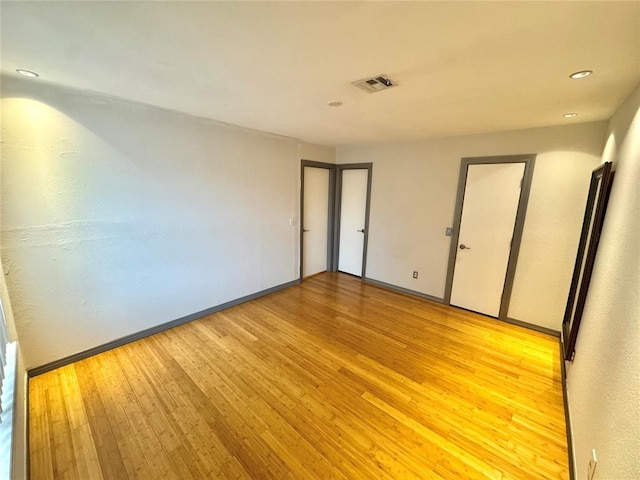 4400 Hemingway Dr Unit 202, Oklahoma City, OK 73118 - unfurnished room with light wood finished floors and recessed lighting