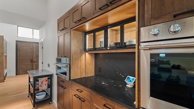 10105 SW 25th Ct, Yukon, OK 73099 - kitchen with stainless steel oven and light wood-style flooring