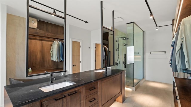 10105 SW 25th Ct, Yukon, OK 73099 - full bathroom with a shower stall, double vanity, and rail lighting