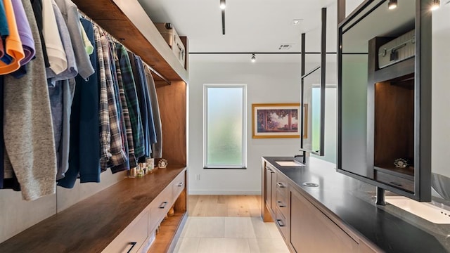 10105 SW 25th Ct, Yukon, OK 73099 - bathroom featuring double vanity and track lighting