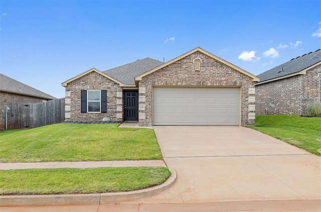 521 Audrey Dr, Tuttle, OK 73089 - single story home with brick siding, a garage, concrete driveway, and roof with shingles