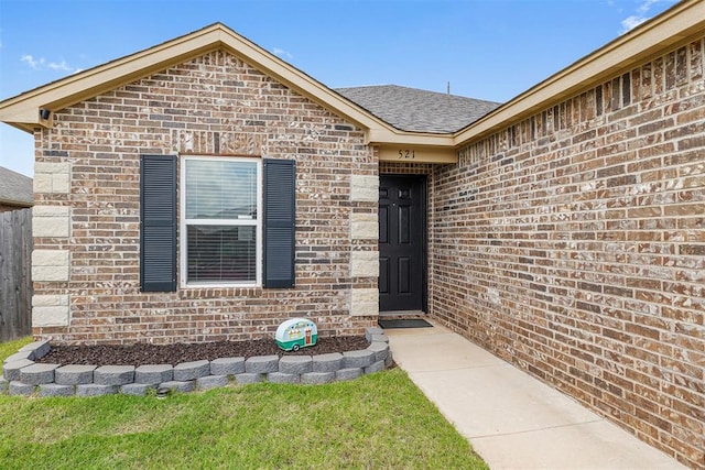 521 Audrey Dr, Tuttle, OK 73089 - view of exterior entry featuring brick siding