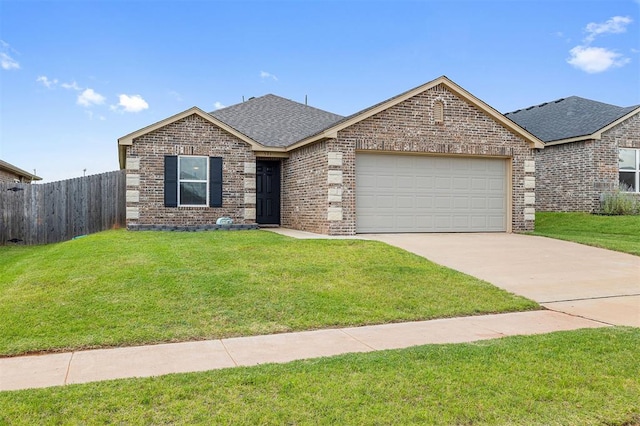 521 Audrey Dr, Tuttle, OK 73089 - ranch-style home with a shingled roof, a garage, brick siding, and driveway