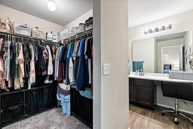 521 Audrey Dr, Tuttle, OK 73089 - spacious closet featuring wood finished floors and a sink