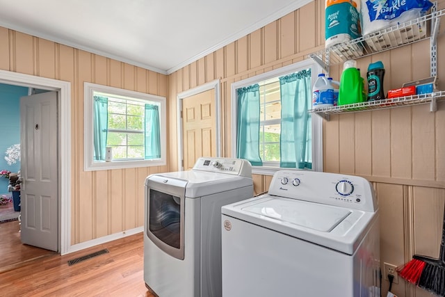 508 Newton Ave, Ozark, AL 36360 - laundry room with independent washer and dryer, wood finished floors, baseboards, and crown molding