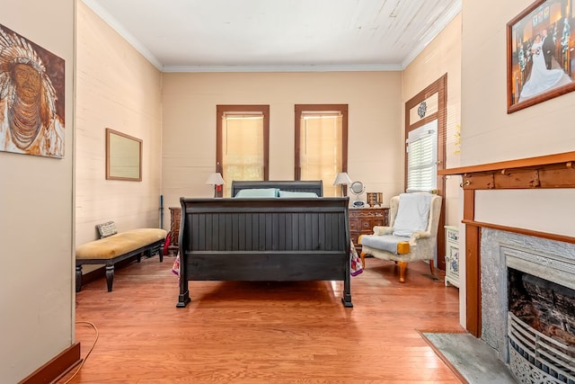 508 Newton Ave, Ozark, AL 36360 - bedroom featuring light wood-type flooring, crown molding, and a high end fireplace