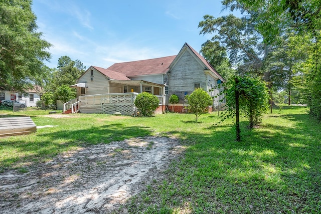 508 Newton Ave, Ozark, AL 36360 - view of grassy yard featuring a deck