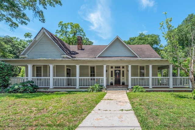 508 Newton Ave, Ozark, AL 36360 - farmhouse-style home featuring covered porch, a chimney, and a front lawn