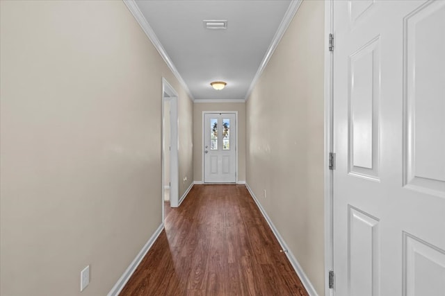 entryway featuring crown molding and dark wood-type flooring