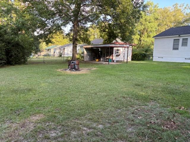 123 Hedstrom Dr, Dothan, AL 36301 - view of yard with a shed and view of scattered trees