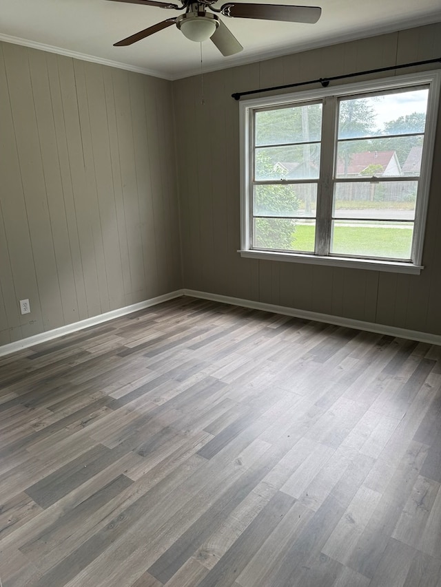 123 Hedstrom Dr, Dothan, AL 36301 - empty room with a ceiling fan, wood finished floors, and ornamental molding