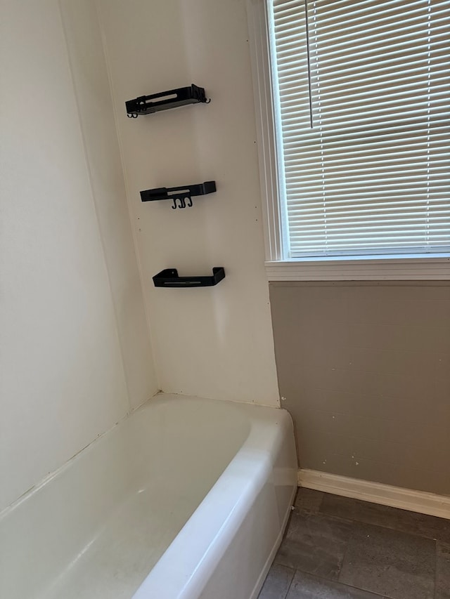 123 Hedstrom Dr, Dothan, AL 36301 - bathroom featuring a tub and baseboards