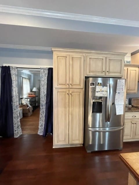 kitchen featuring ornamental molding, stainless steel refrigerator with ice dispenser, and dark wood-type flooring