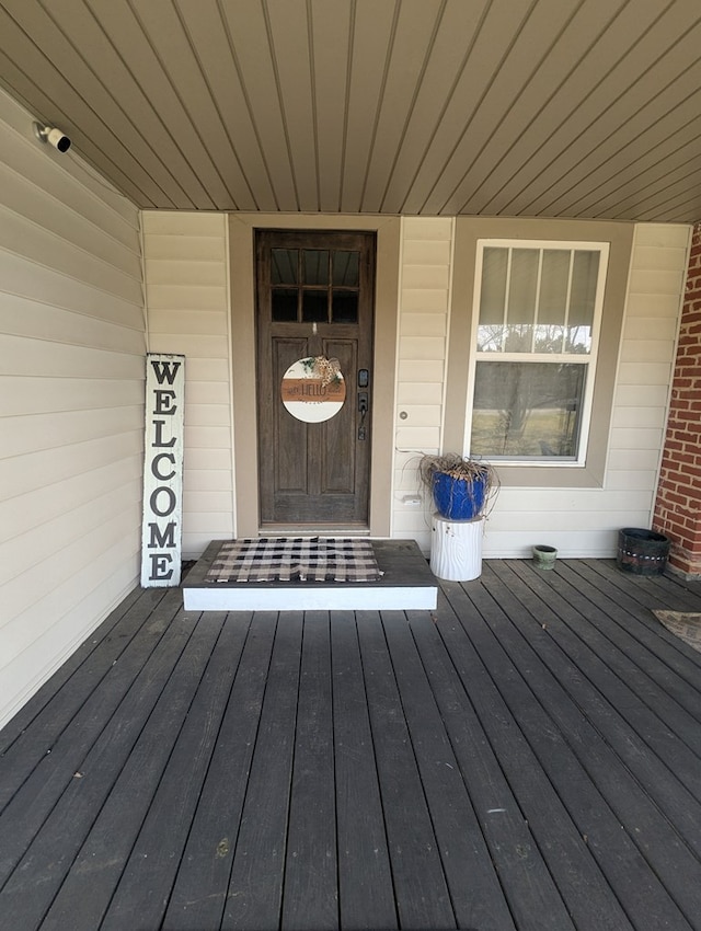 entrance to property featuring a porch