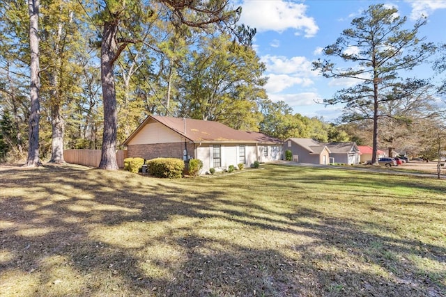 view of home's exterior with a lawn