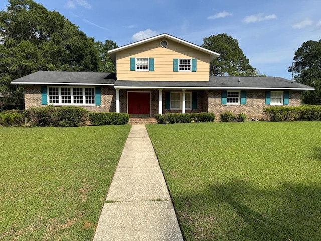 2403 Stonebridge Rd, Dothan, AL 36301 - traditional-style home with brick siding, a porch, and a front lawn