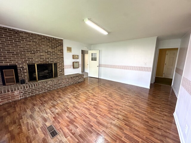2403 Stonebridge Rd, Dothan, AL 36301 - unfurnished living room with wood finished floors and a fireplace