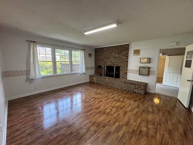 2403 Stonebridge Rd, Dothan, AL 36301 - unfurnished living room featuring wood finished floors, baseboards, and a fireplace