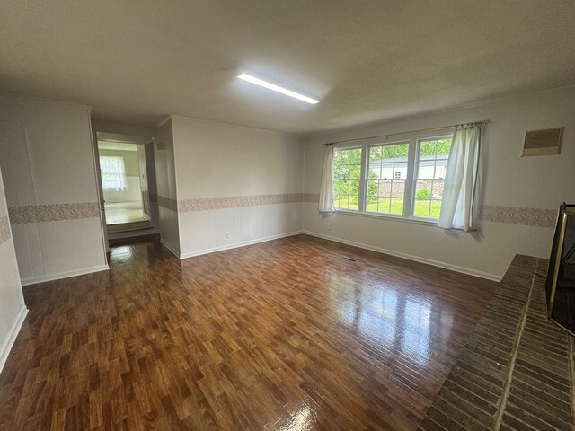 2403 Stonebridge Rd, Dothan, AL 36301 - unfurnished room featuring dark wood-style floors, wainscoting, and baseboards