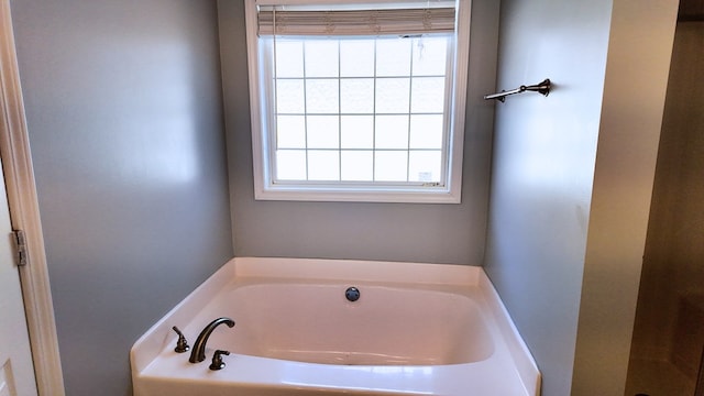 bathroom featuring a bath