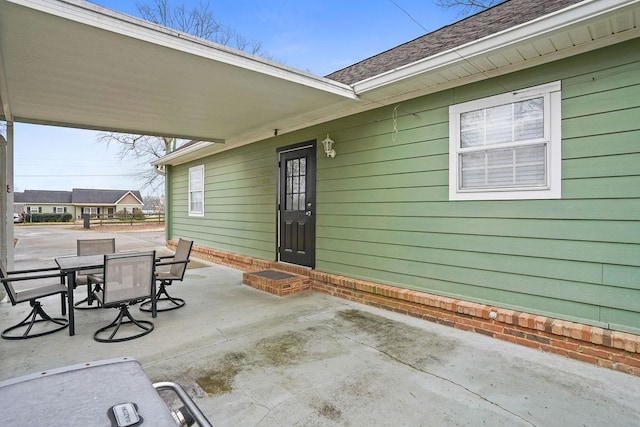 view of patio featuring outdoor dining area