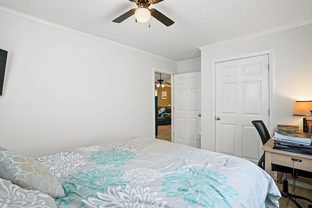 bedroom featuring ornamental molding and a ceiling fan